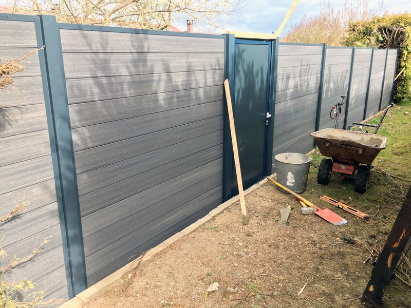 Installing a gray composite fence