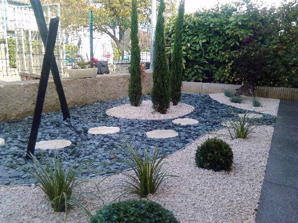 Mineral bed with cypress trees and pebbles
